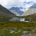 Breathtaking view of alpine mountains and lake in the Swiss Alps.