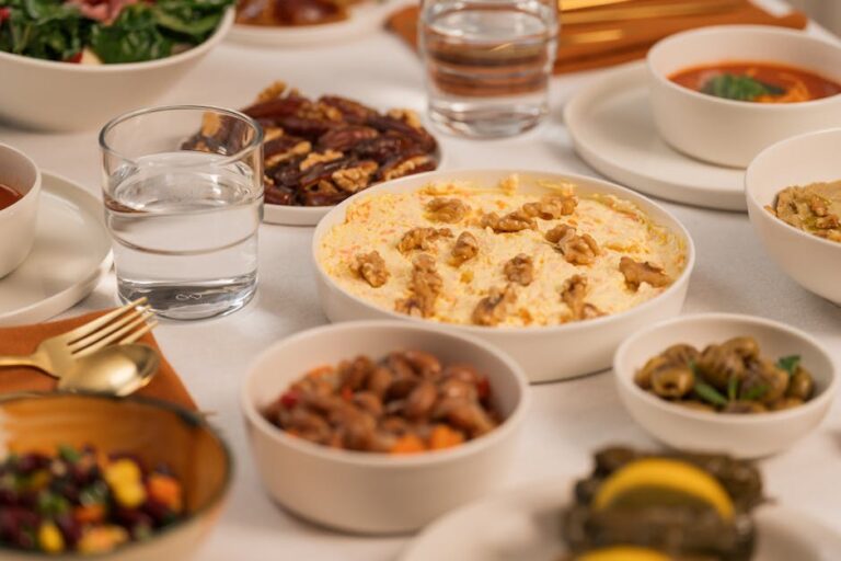 A table set for Iftar featuring an assortment of traditional dishes and drinks, perfect for Ramadan.