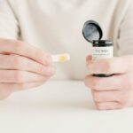 A detailed view of hands holding diabetes test strips, ideal for healthcare and medical themes.